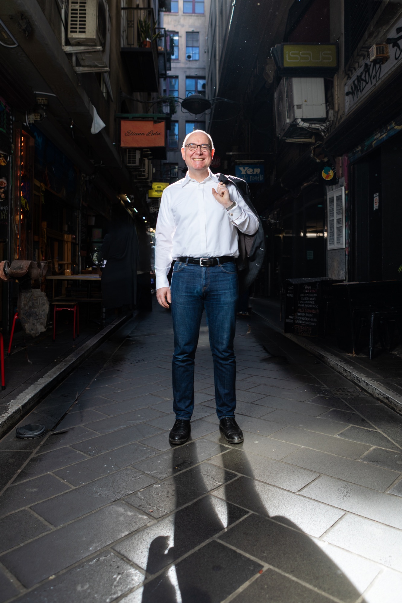 Portrait in a laneway under directional light