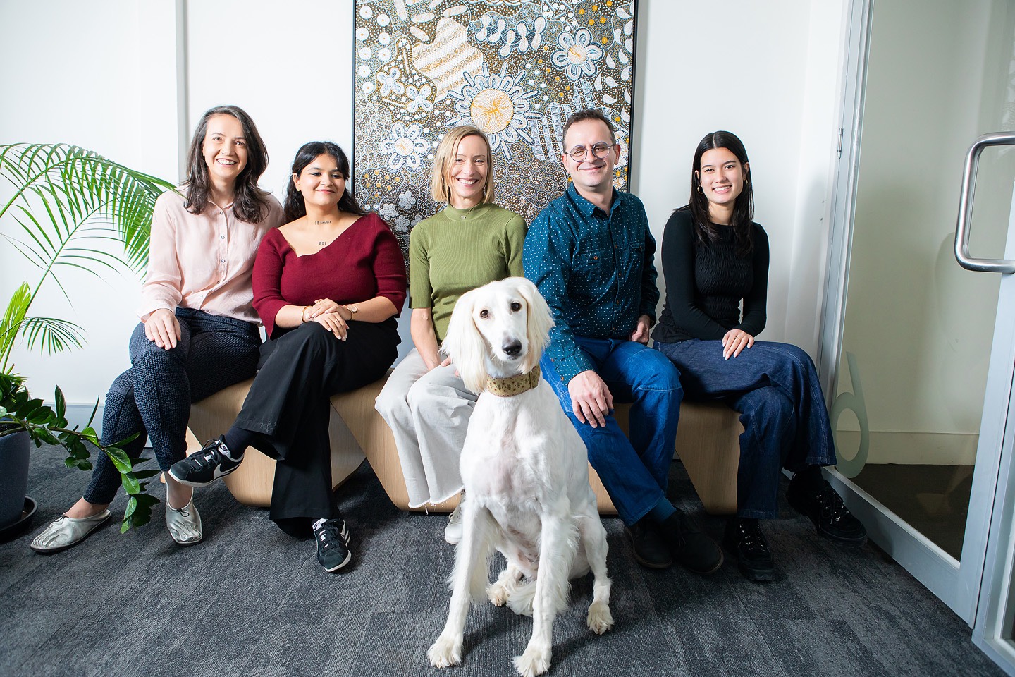 Team portrait with the office dog